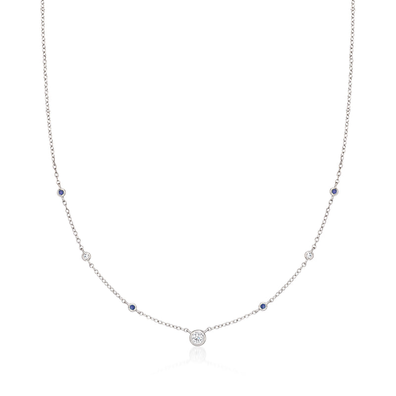 Sterling silver station necklace with round diamonds and blue sapphire accents