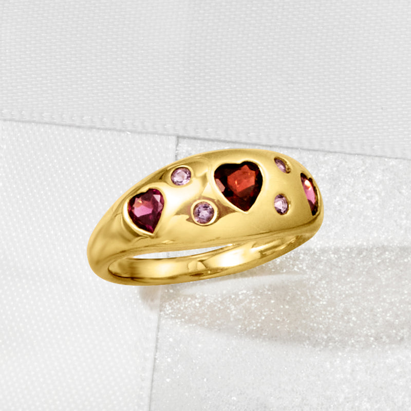 Gold ring top with red heart center and purple side stones, bezel-set