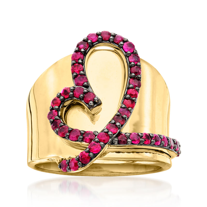 Gold heart ring with pink gemstone accents, oval heart centerpiece and openwork
