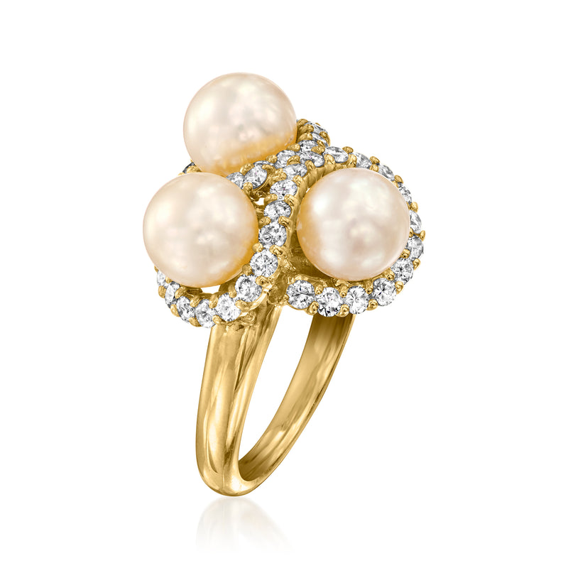 18k yellow gold ring with three round cultured pearls and diamond halo settings