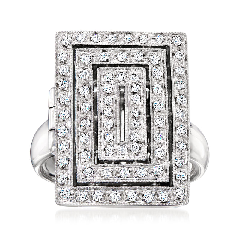 White gold diamond locket-style ring with square bezel and halo of small stones