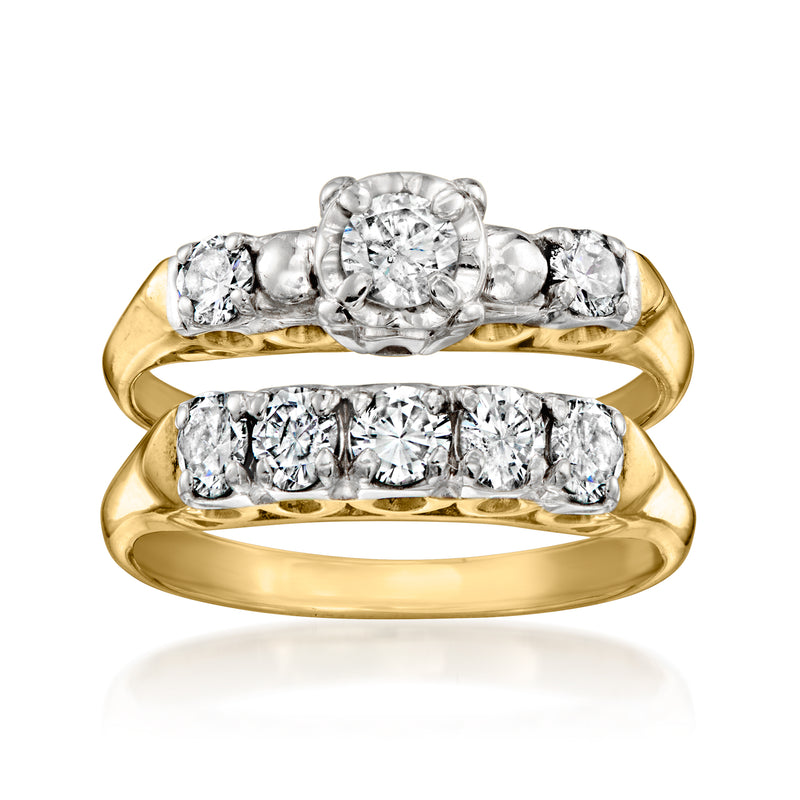 Vintage 14kt yellow gold diamond ring set with round center stone and side diamonds