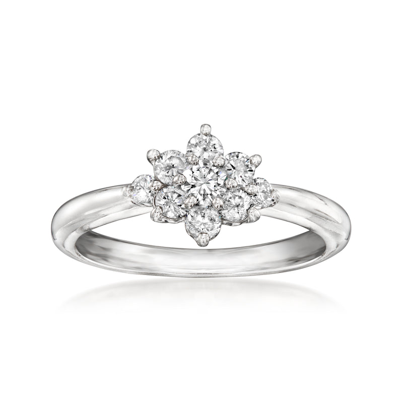 Platinum diamond cluster ring with oval center and marquise side stones