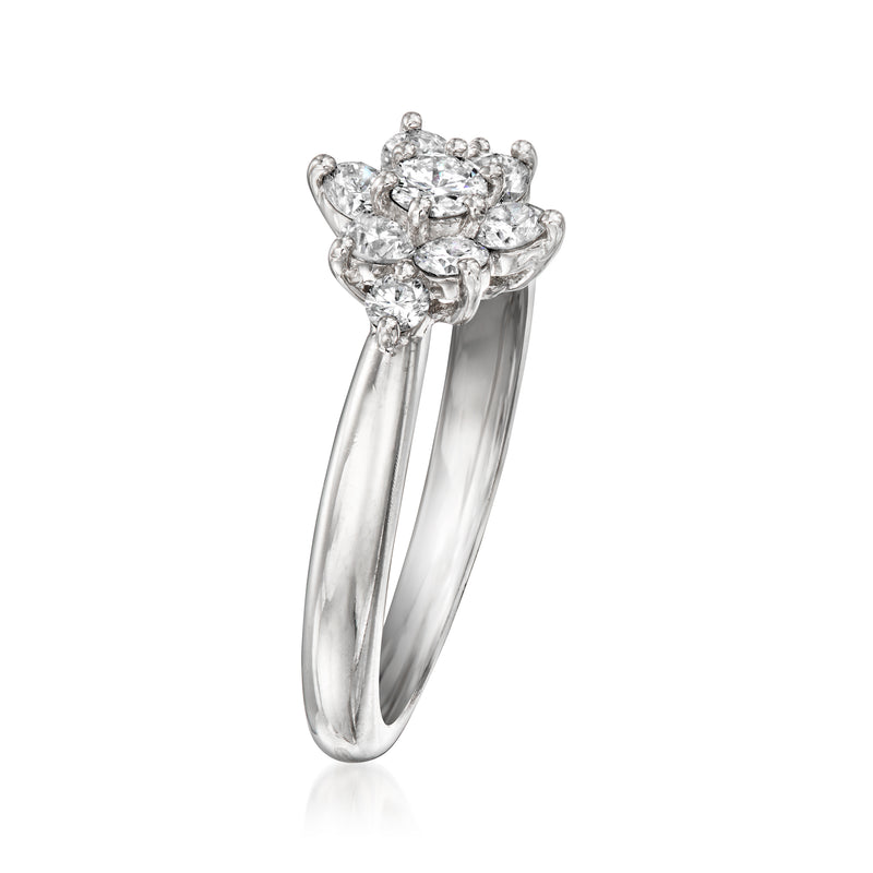 Platinum vintage diamond cluster ring with raised floral setting and open band