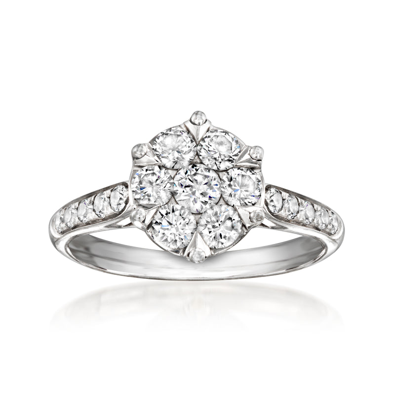 Vintage diamond flower ring in 14kt white gold with central round and side stones