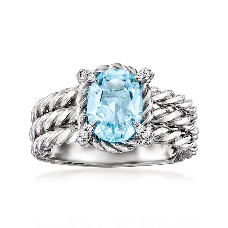 Sterling silver three-row ring with sky blue topaz center and white topaz accents