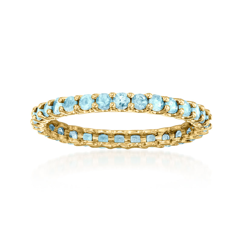 14kt yellow gold eternity band with Swiss blue topaz rows and openwork sides