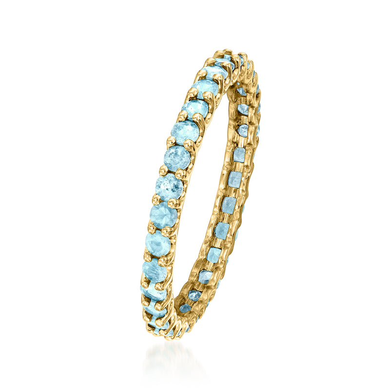 Swiss blue topaz eternity band in 14kt yellow gold, angled side view