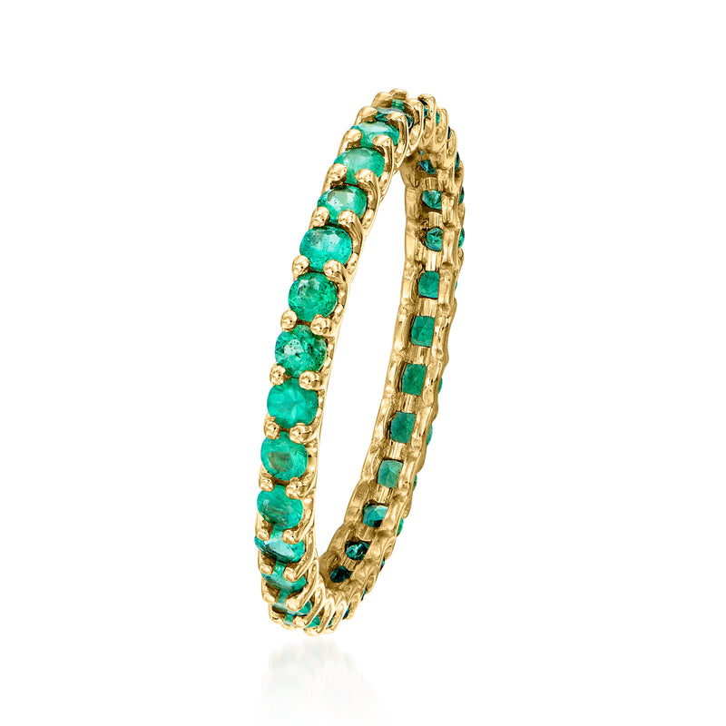 14kt yellow gold eternity band with rows of green emerald-cut stones, side view.