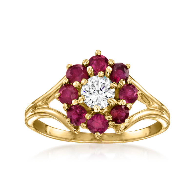 14kt yellow gold flower ring with central clear CZ and ruby-red oval stones