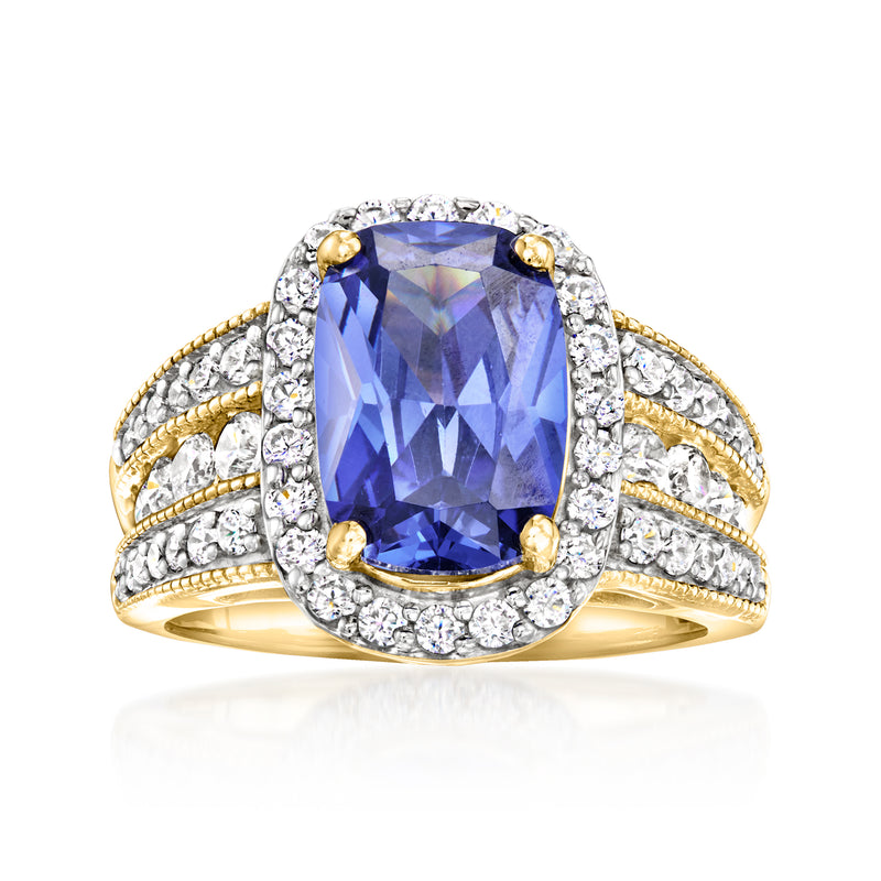 18kt gold over sterling ring with oval blue simulated sapphire, CZ halo and split shank