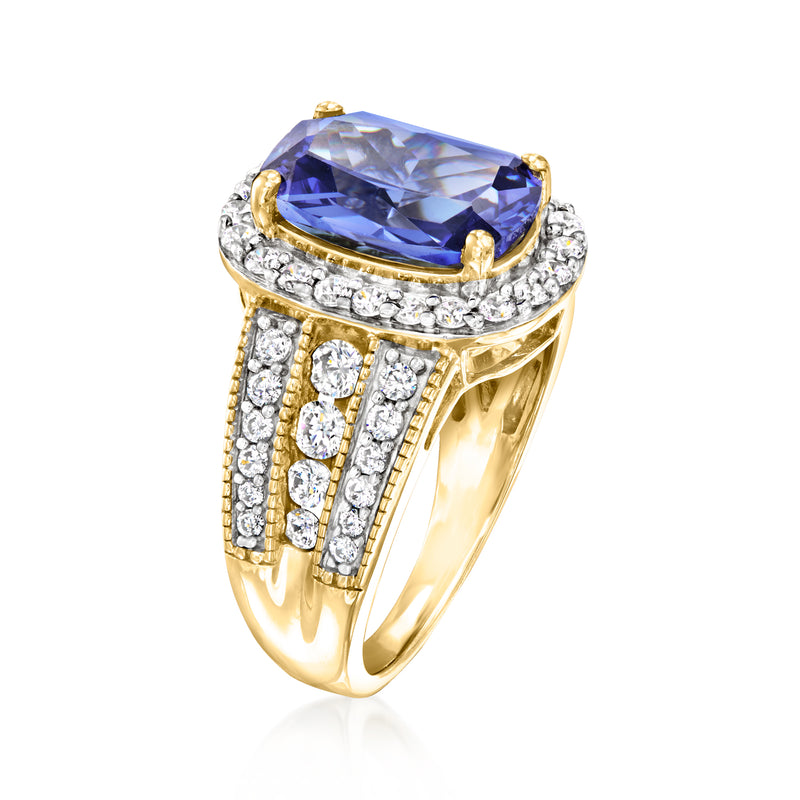 Side view oval blue simulated sapphire CZ halo ring with gold prongs and open split band