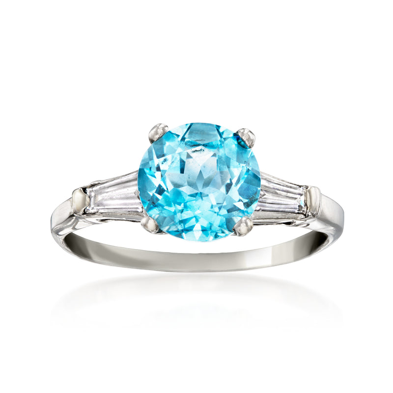 Platinum vintage ring with oval sky-blue topaz and baguette diamond side stones