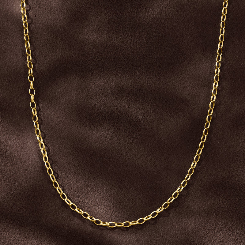 Rolo-link gold over sterling necklace displayed on dark surface with oval chain links
