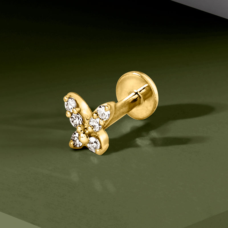 Butterfly diamond stud earring in 14kt yellow gold, worn on ear
