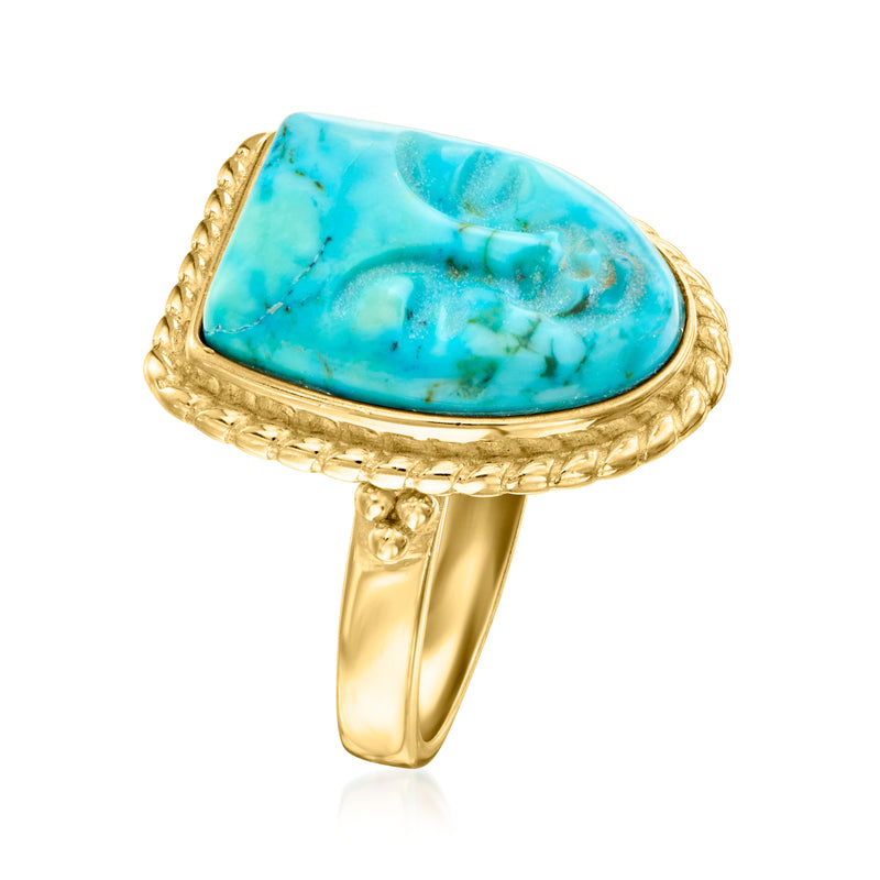 Gold-tone open band ring with oval blue magnesite cabochon and twisted frame