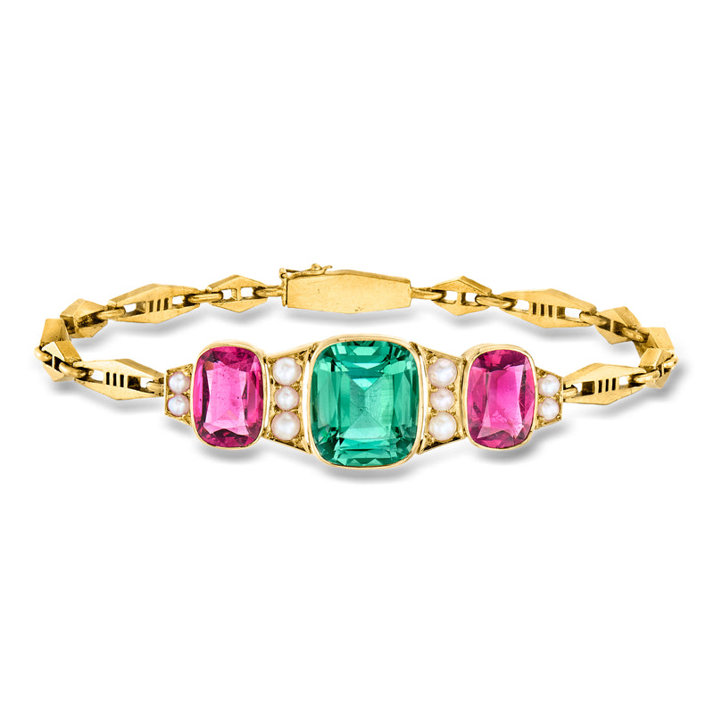 Yellow gold bracelet with green center gemstone, pink stones, and cultured pearls
