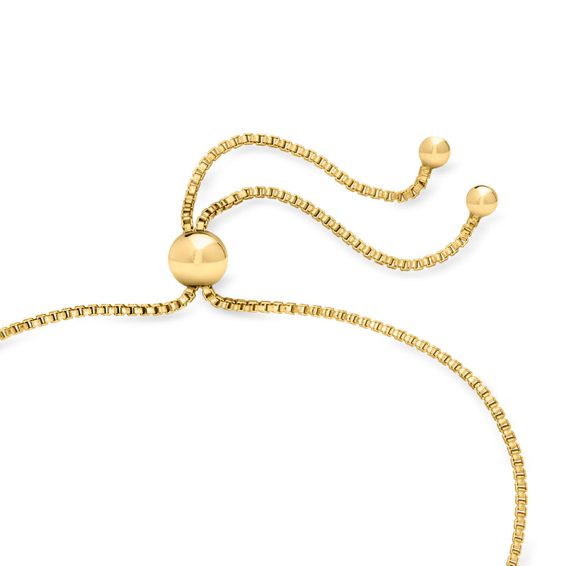 Gold bolo bracelet with ball accents and chain slider detail