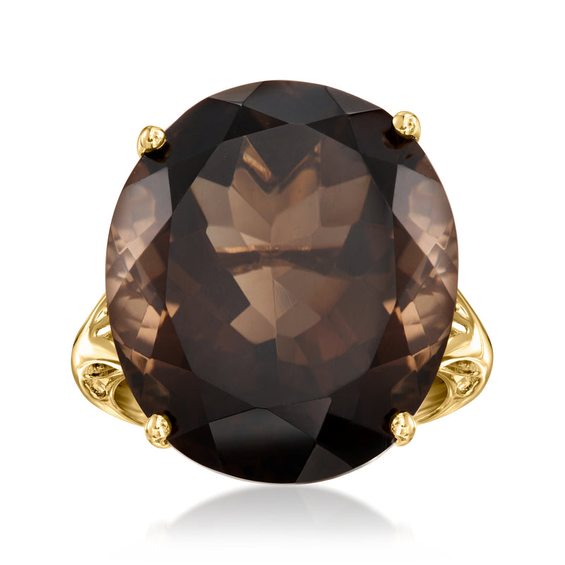 Smoky quartz oval ring in 14kt yellow gold with four prongs and pink side stones