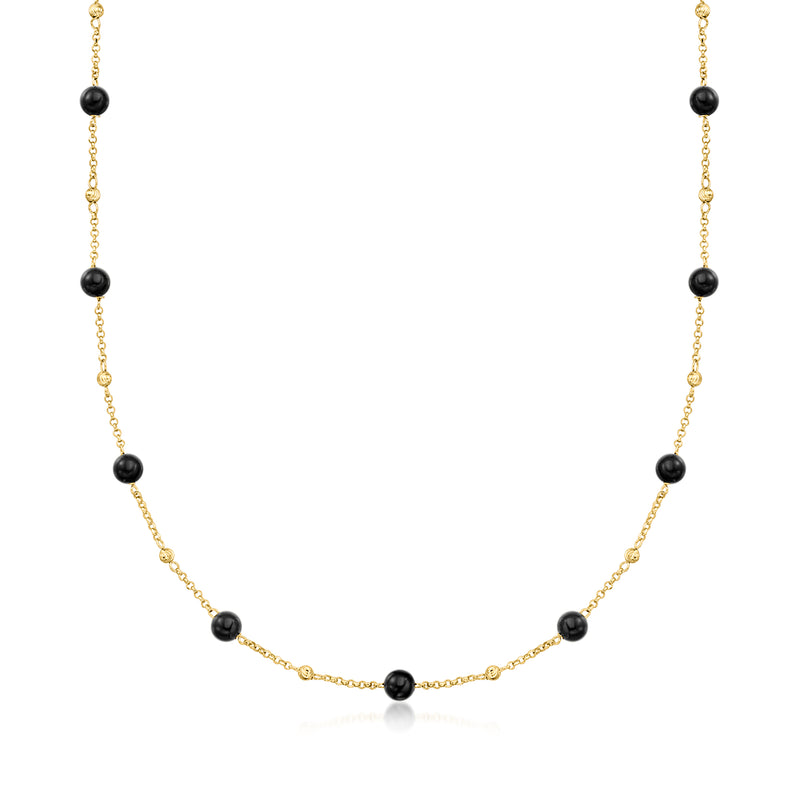 Gold station necklace with small round black onyx beads on a delicate chain