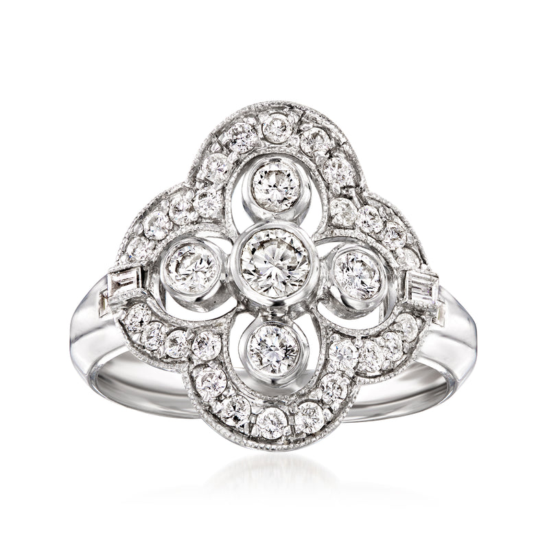 White gold diamond cluster ring with round stones in a halo, size 7.5