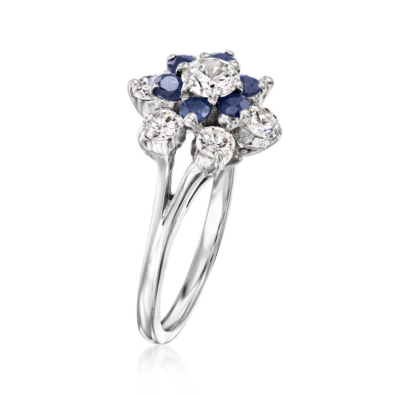 Cluster gemstone ring in 14kt white gold with diamonds and dark blue sapphires