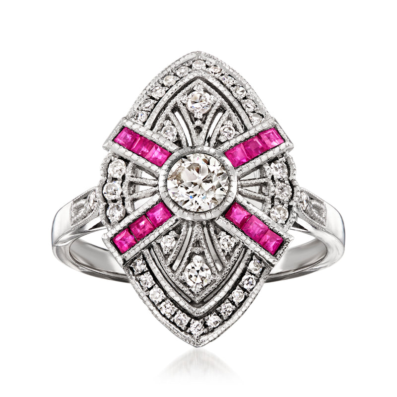 Platinum vintage-style ring with round diamond center and pink ruby stone accents