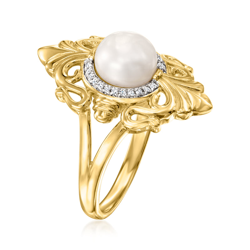 Gold ring with white pearl and diamond bezel, sculpted leaf-pattern shoulders