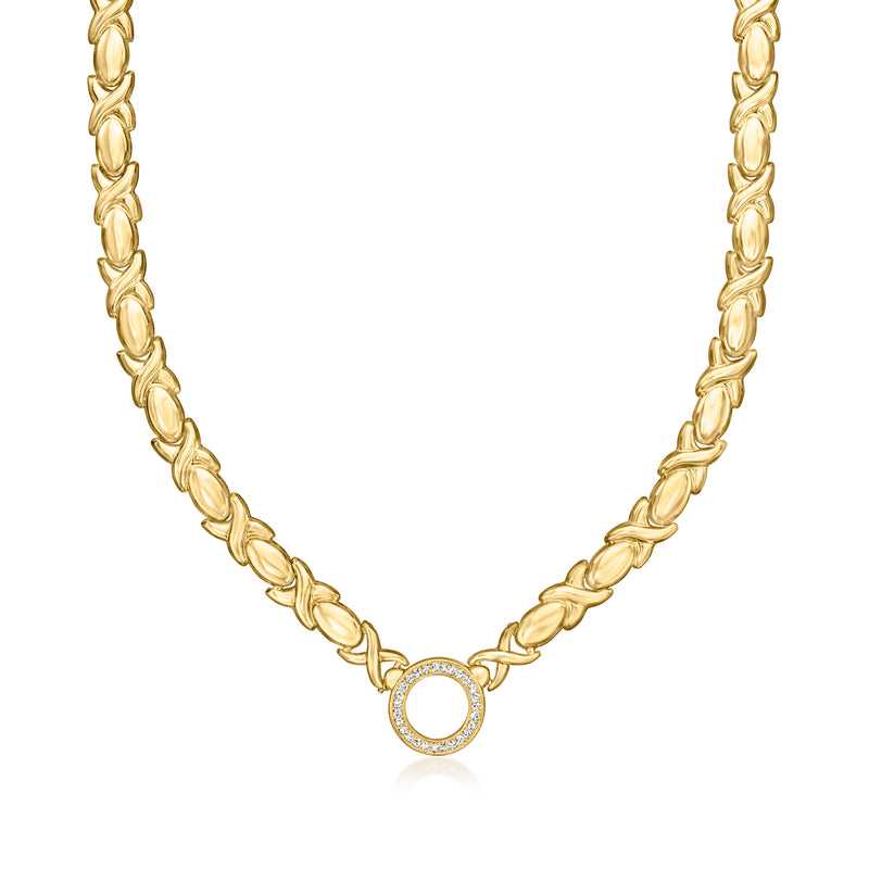 Gold XO diamond pendant necklace with circular stone detail on link chain