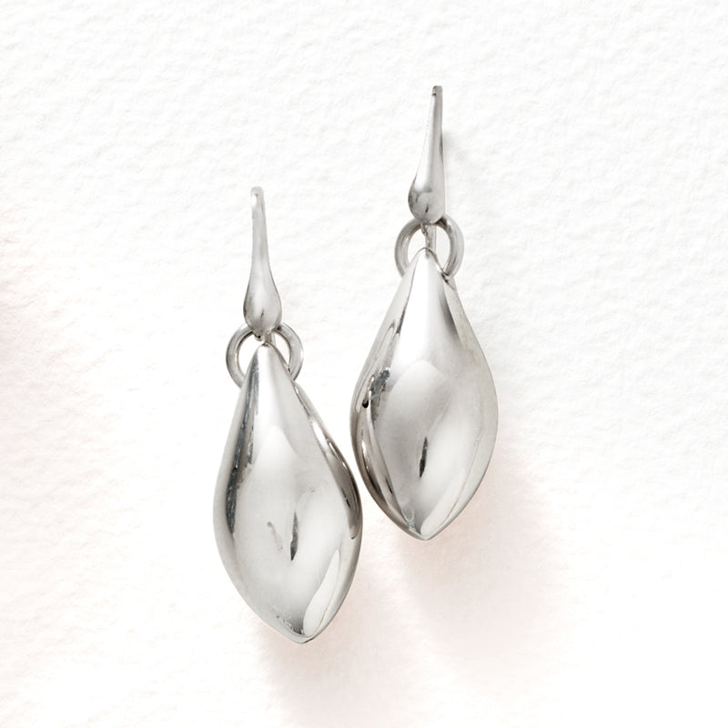 Sterling silver oval domed drop earrings, polished finish with earwire hoops.