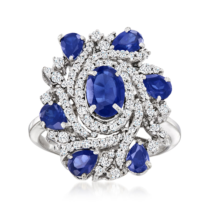 18kt white gold cluster ring with oval blue sapphires and diamond accents
