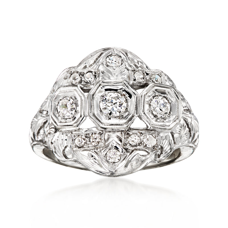 Vintage white gold diamond cluster ring with hexagonal settings and three central stones