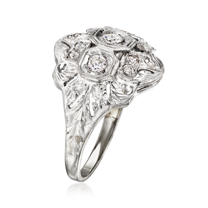 Vintage white gold diamond cluster ring, angled view with multiple faceted stones