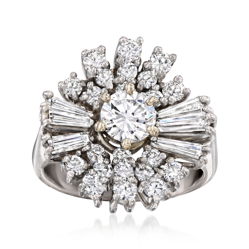 Diamond cluster ring in 18kt white gold with central round diamond and side baguettes