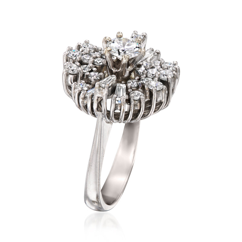 Diamond cluster ring in white gold, side view with scalloped prongs and round center stone