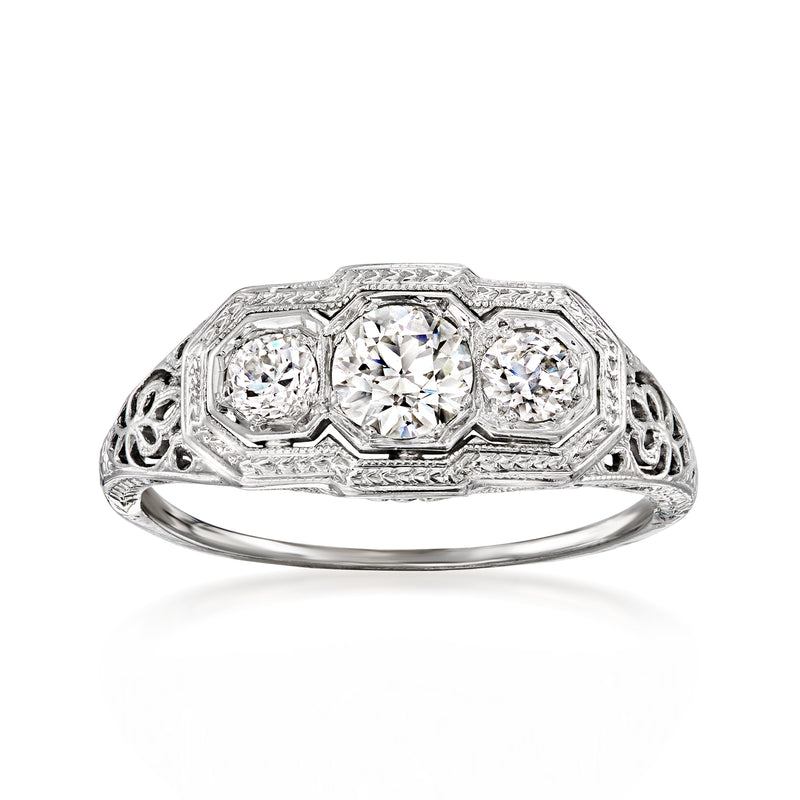 Vintage white gold three-stone diamond ring, oval center with two side diamonds
