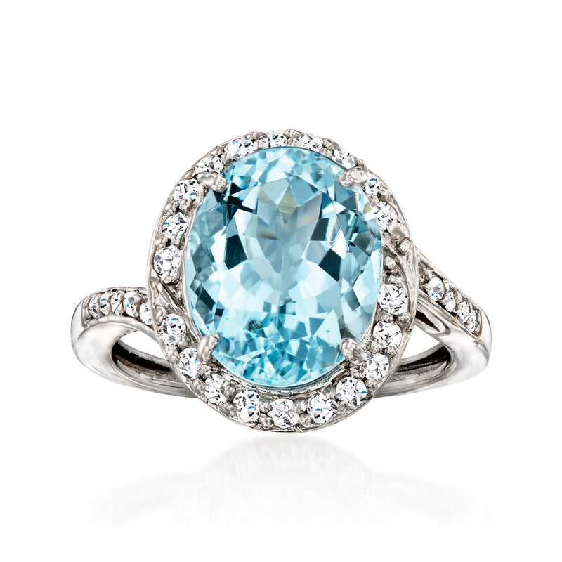 Vintage aquamarine diamond halo ring in 14kt white gold, oval gemstone with side diamonds