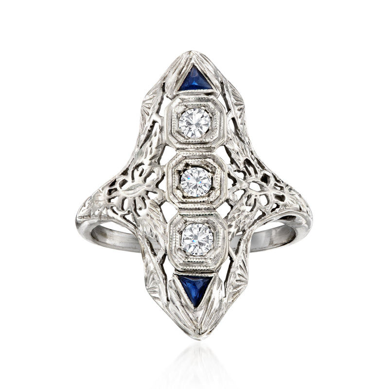 Vintage white gold filigree diamond ring with three center stones and blue sapphire accents