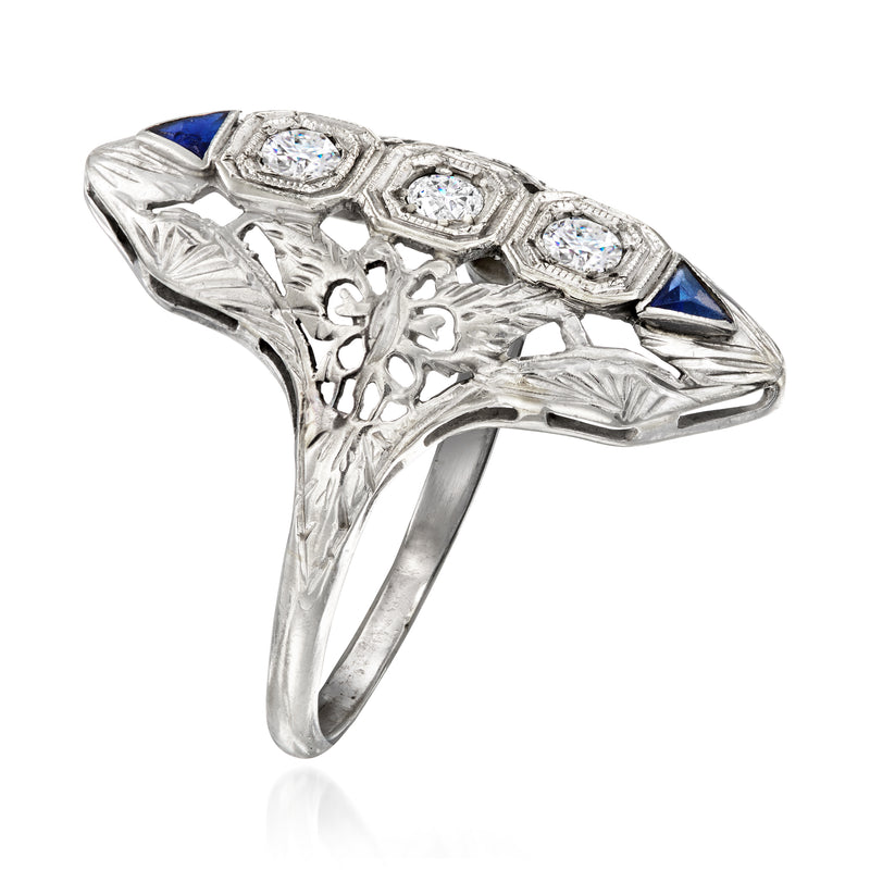 Vintage white gold filigree diamond ring, side view with blue sapphire inlay and bezel-set stones