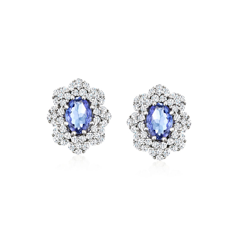 14kt white gold flower stud earrings with blue tanzanite center and diamond halo