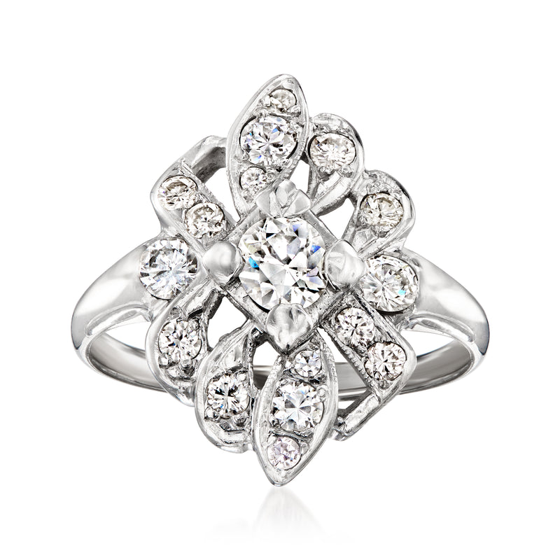 Vintage diamond cluster ring in white gold with large center round stone and halo