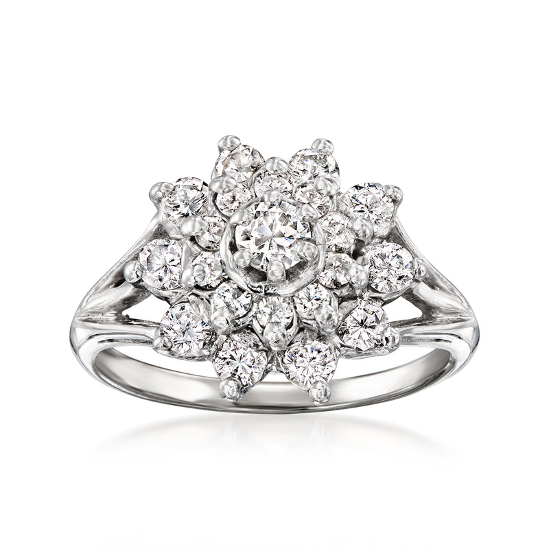 Vintage diamond cluster ring in 14kt white gold with round halo of diamonds