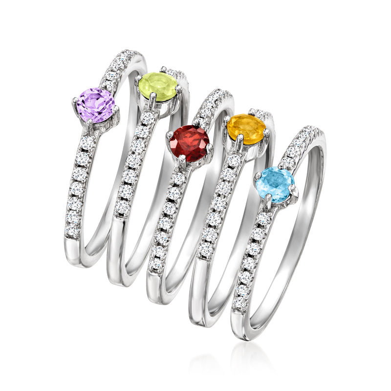 Five sterling silver rings with oval purple, green, red, yellow, and light-blue gems
