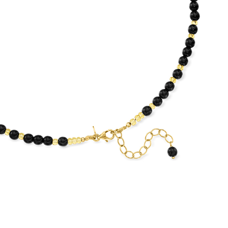 Murano bead necklace with gold clasp and short extender chain; black beads with amber pattern