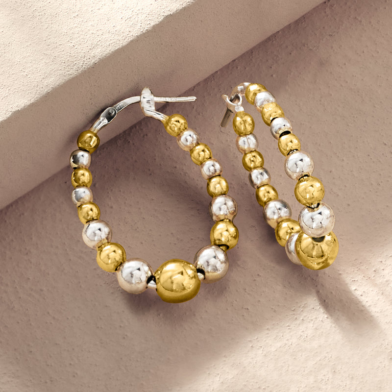 Gold and silver beaded oval hoop earrings, top view