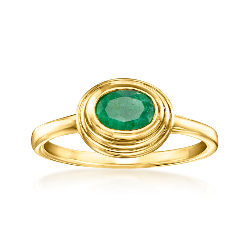 Gold ring with oval emerald-green gemstone and coiled halo, polished band
