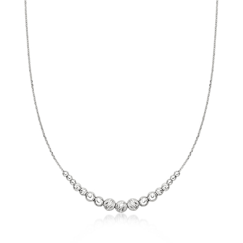 Sterling silver diamond-cut bead station necklace with round beads along a fine chain