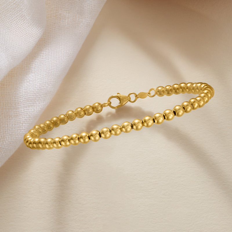 14kt yellow gold bead bracelet with round ball links and hinge clasp detail