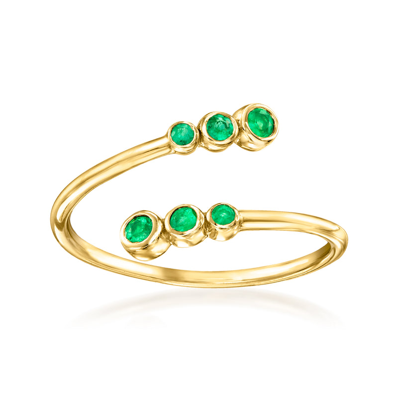 10kt yellow gold bypass ring with three green emerald stones in bezel settings