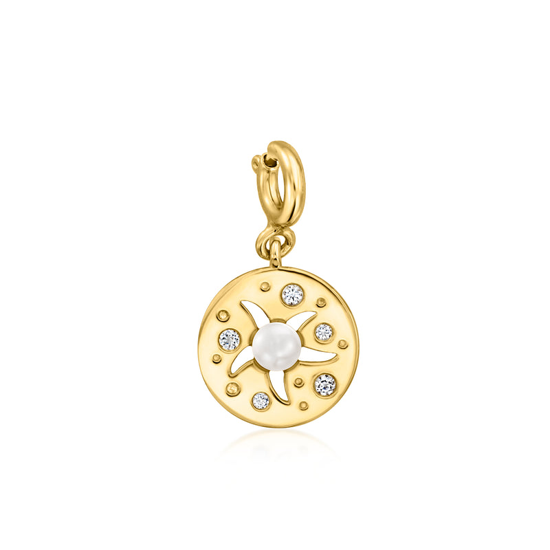 Gold charm pendant with round white pearl center and small clear stone accents